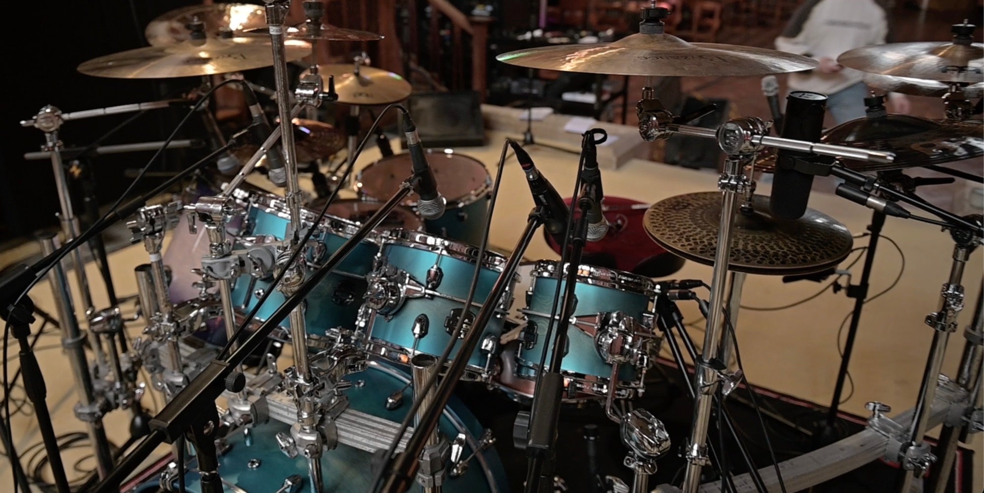 Close-up of the drum kit and microphone setup in the live room